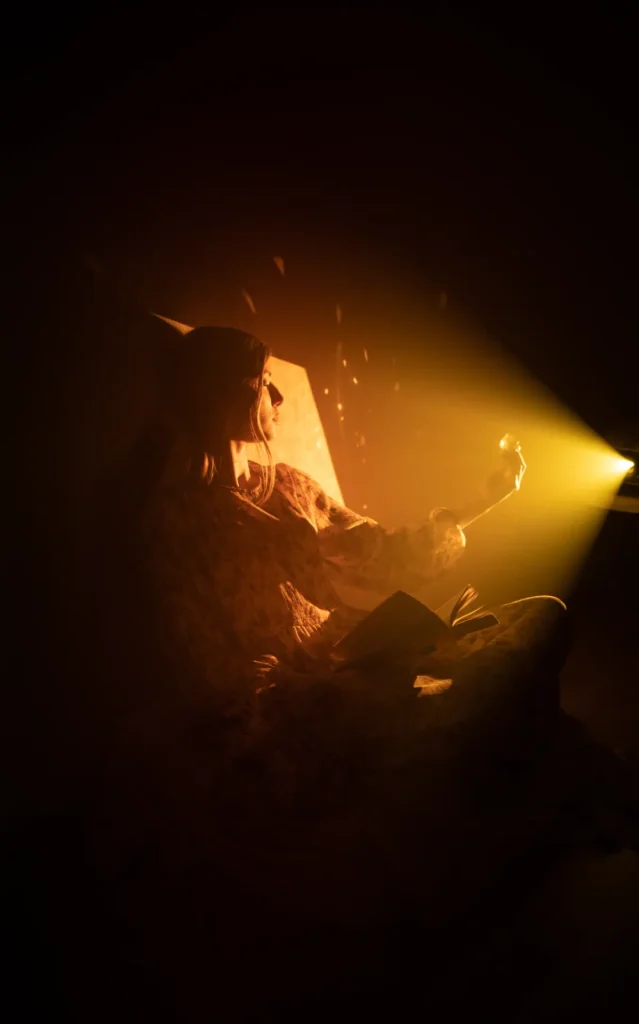 girl-in-a-ray-of-magic-light-with-an-open-book-and-2024-10-14-20-35-14-utc